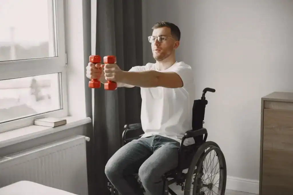 Image of man doing exercise in his wheelchair to aid weight loss Godalming
