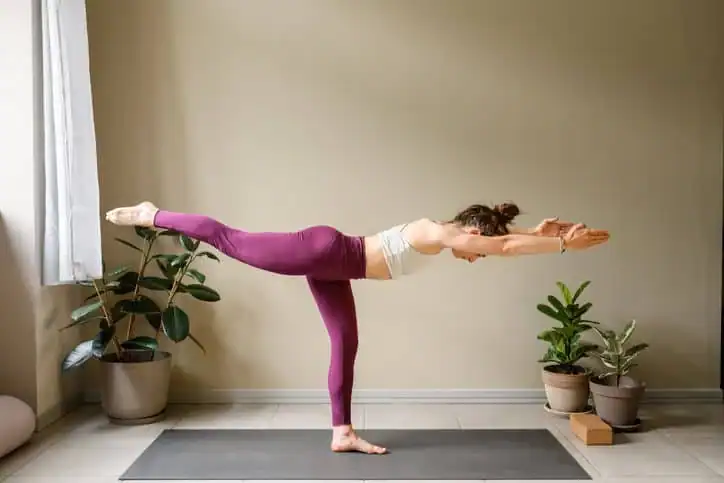 Woman doing Yoga exercise Godalming to help with toning the body. 