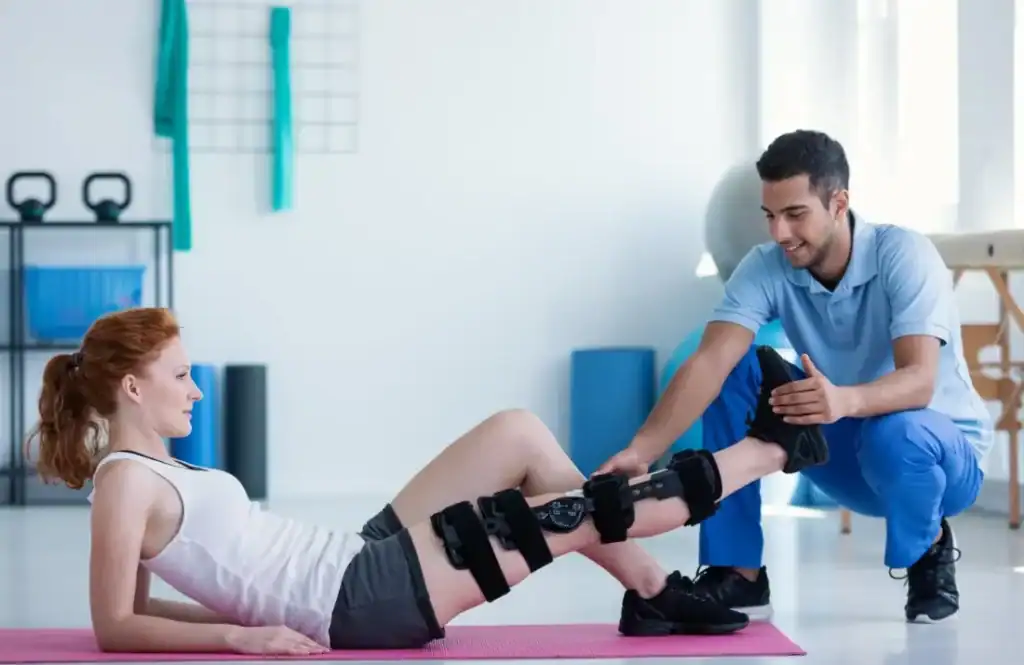 Woman having treatment to help muscle recovery Godalming after an injury